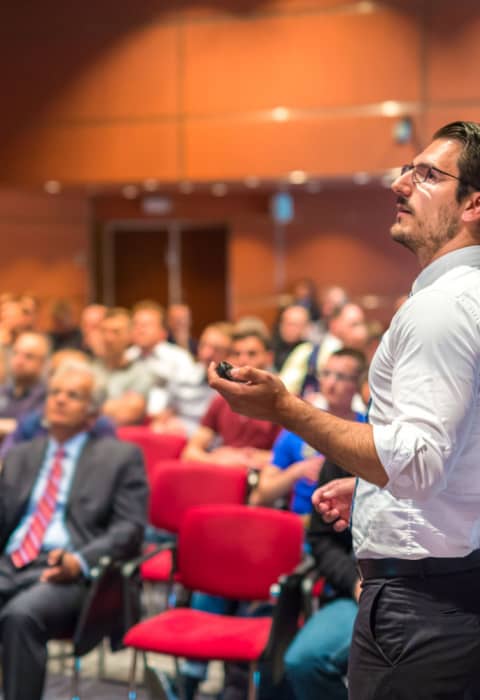 a speaker at a business event